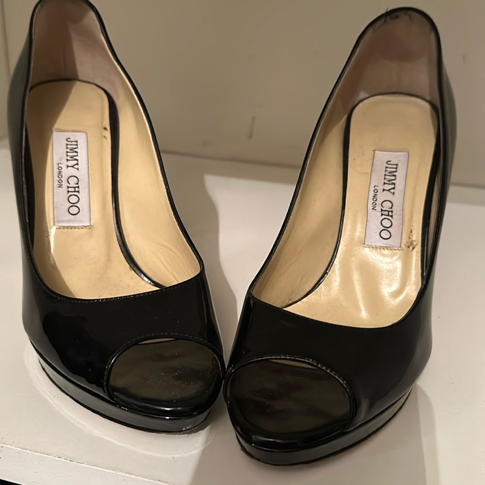 Woman’s authentic Jimmy Choo platform patent leather open toe heels